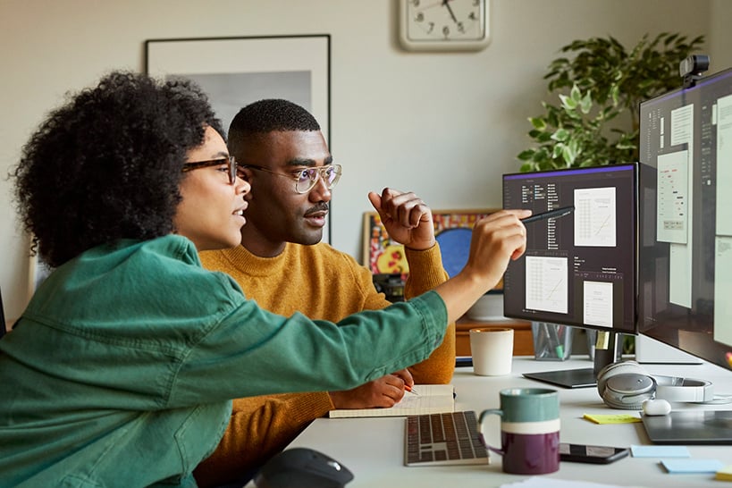 co-workers looking at computer